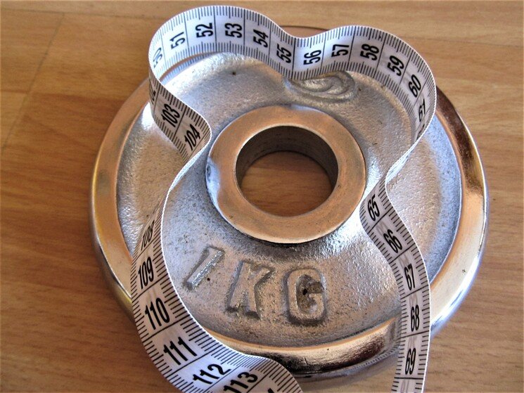 Halterschijf met meetlint.